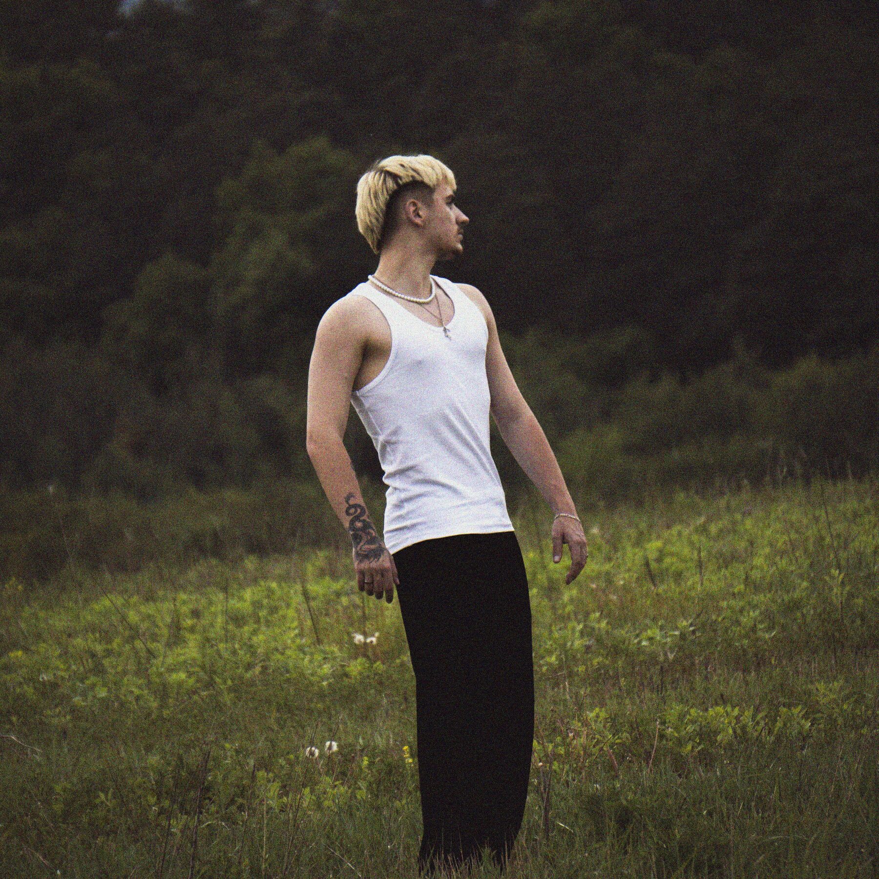 Tomáš Belan standing in a field